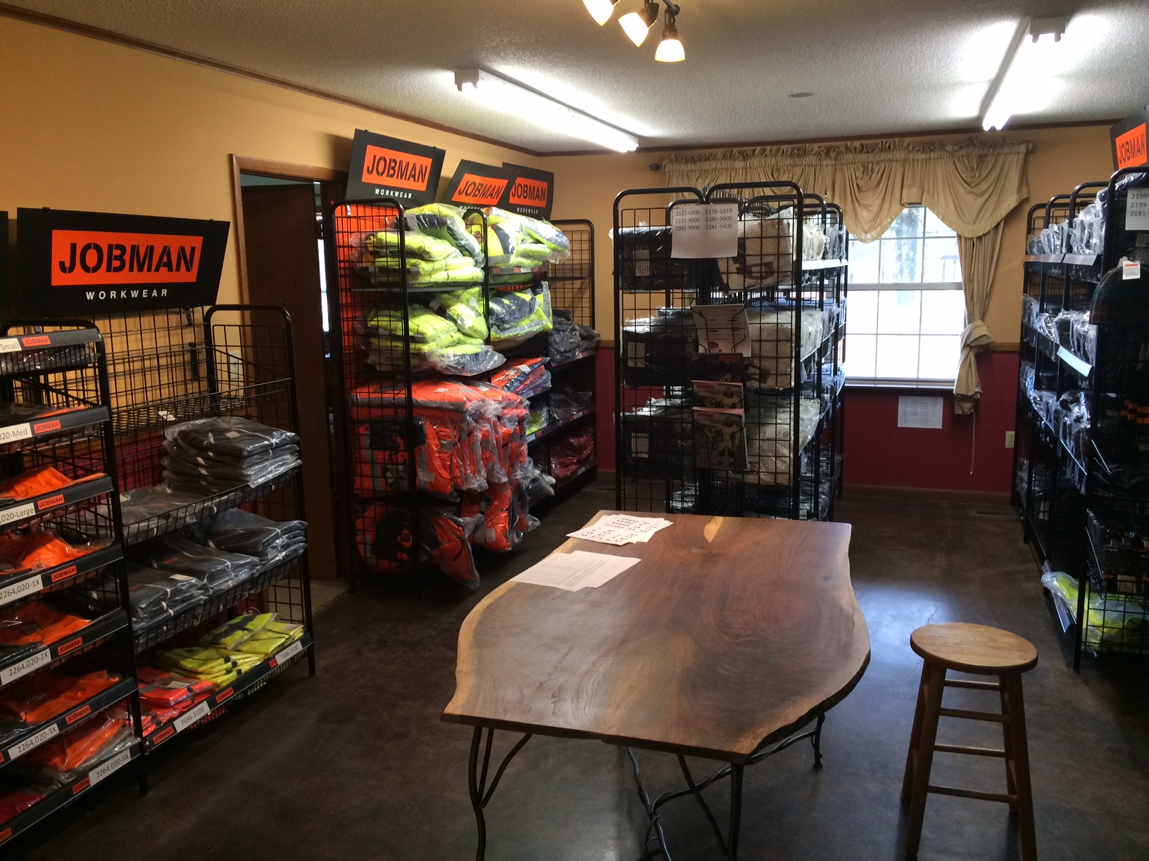 JOBMAN Workwear hero image showing durable work pants and jacket